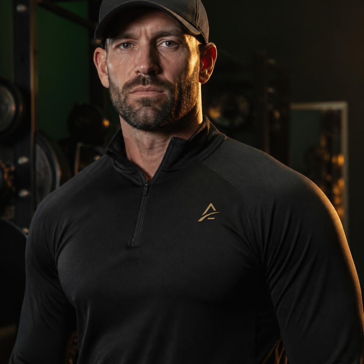 Athlete wearing a black quarter-zip long-sleeve performance top
